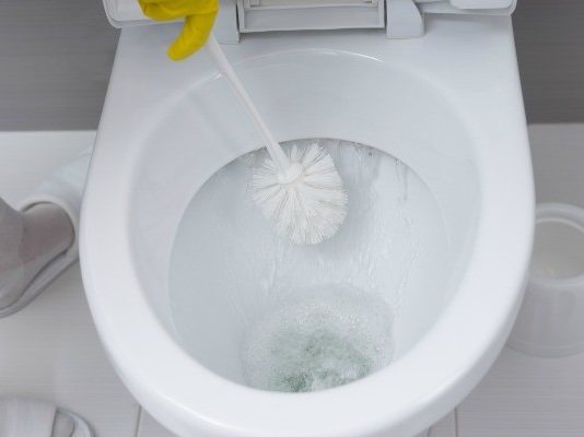 cleaning toilet