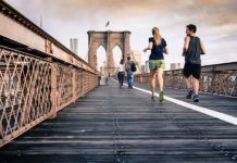 people crossing bridge