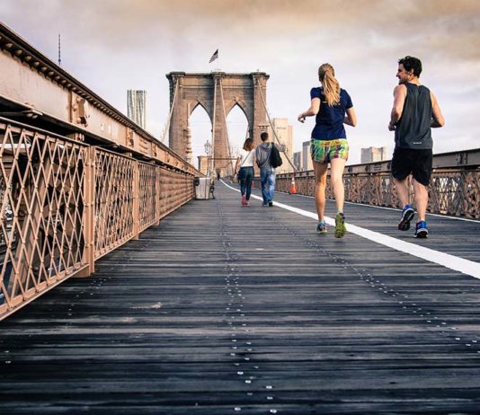 people crossing bridge