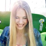 Smiling girl with skateboard