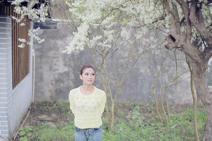 thoughtful girl under tree